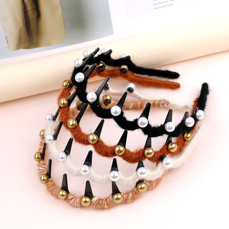 Set of decorative hair ties with beads and pearls on a light background